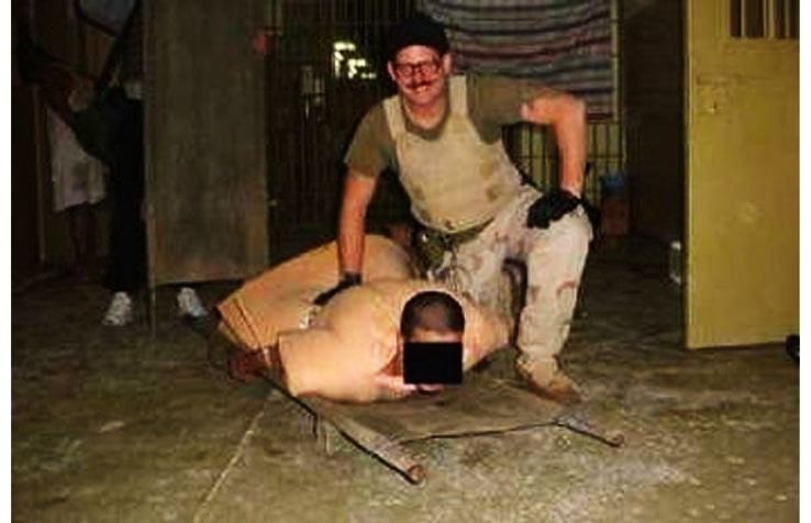 10.  A photo of an Iraqi prisoner